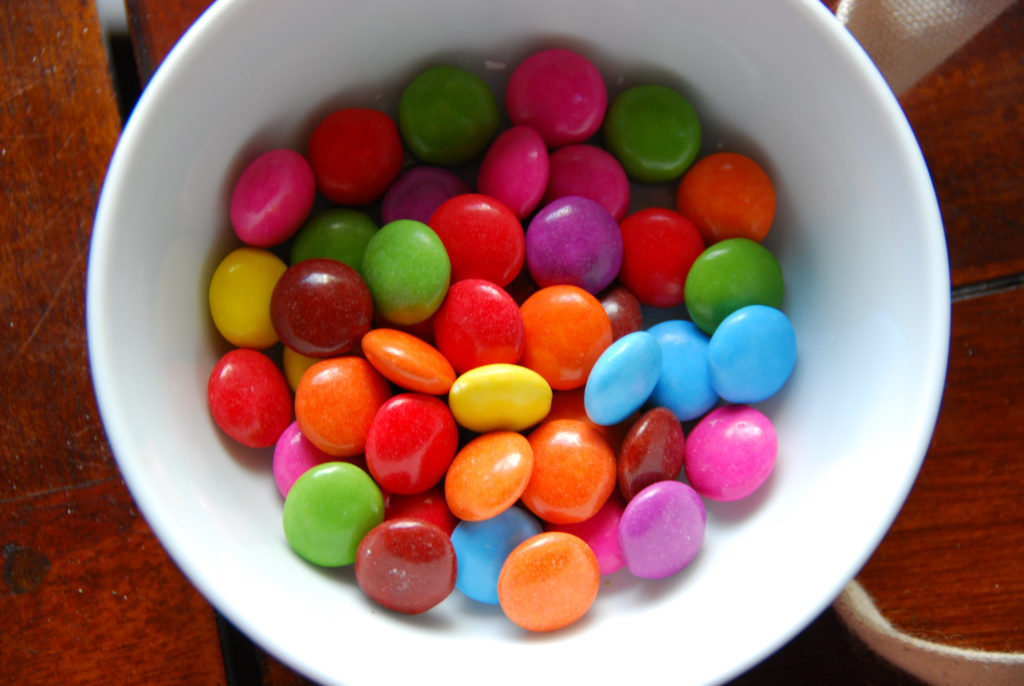 Colorful smarties in a white bowl