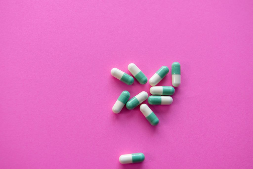 pills on pink background